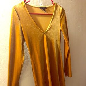 Mustard lowcut mini dress. Worn once.